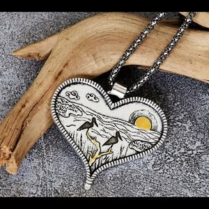 Heart-Shaped Pendant with Bird Design